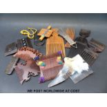 A collection of various hair combs to include wood,