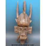 An African tribal mask with a bird to the top, Senufo tribe,