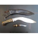 A horn handled kukri knife in leather sheath (31cm blade)