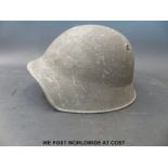 A European military helmet marked K IX to rear of rim