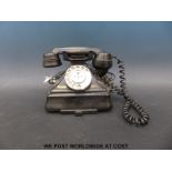 A vintage black bakelite telephone 1/232 CB with modern connections