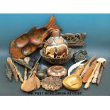 A collection of carved African artefacts to include a gourd, a bowl, spoons,