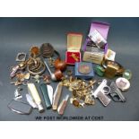 A collection of various collectable items to include lighters, penknives, pipes,