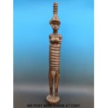 An African tribal female figure with elongated ribbed body (97cm tall)