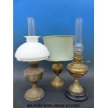 Three brass oil lamps,