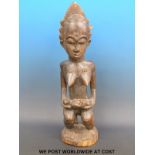 An African tribal Baule maternity figure of a woman holding a child