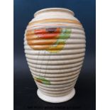 An Art Deco Pottery ribbed vase with sunburst design in the Clarice Cliff style marked D58/433 to