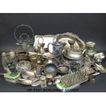 A quantity of silver plated items to include swing-handled trays, dressing table items,
