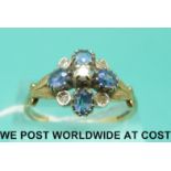 A 9ct gold ring set with diamonds and sapphires in a cluster (size T)