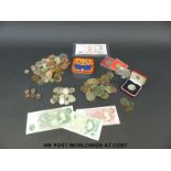 A collection of sundry coinage to include some cased 50 pence pieces, bank notes,