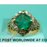 An 18ct gold ring set with a square emerald of approximately 1.