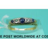 An 18ct gold ring set with diamonds and sapphires (size M)