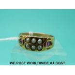 A Victorian 15ct gold ring set with seed pearls and rubies (size T)