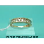 A 9ct gold half eternity ring set with eleven diamonds (size N)