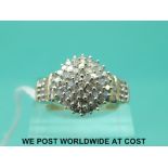 A 9ct gold ring set with diamonds in a cluster (size P)