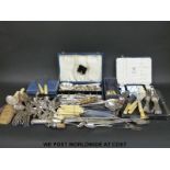 A large quantity of boxed and loose cutlery, including hallmarked silver handled,