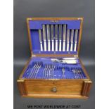 A part canteen of silver plated cutlery in fitted oak box