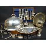 A quantity of silver plated items to include a spirit kettle, candelabra, part canteen of cutlery,