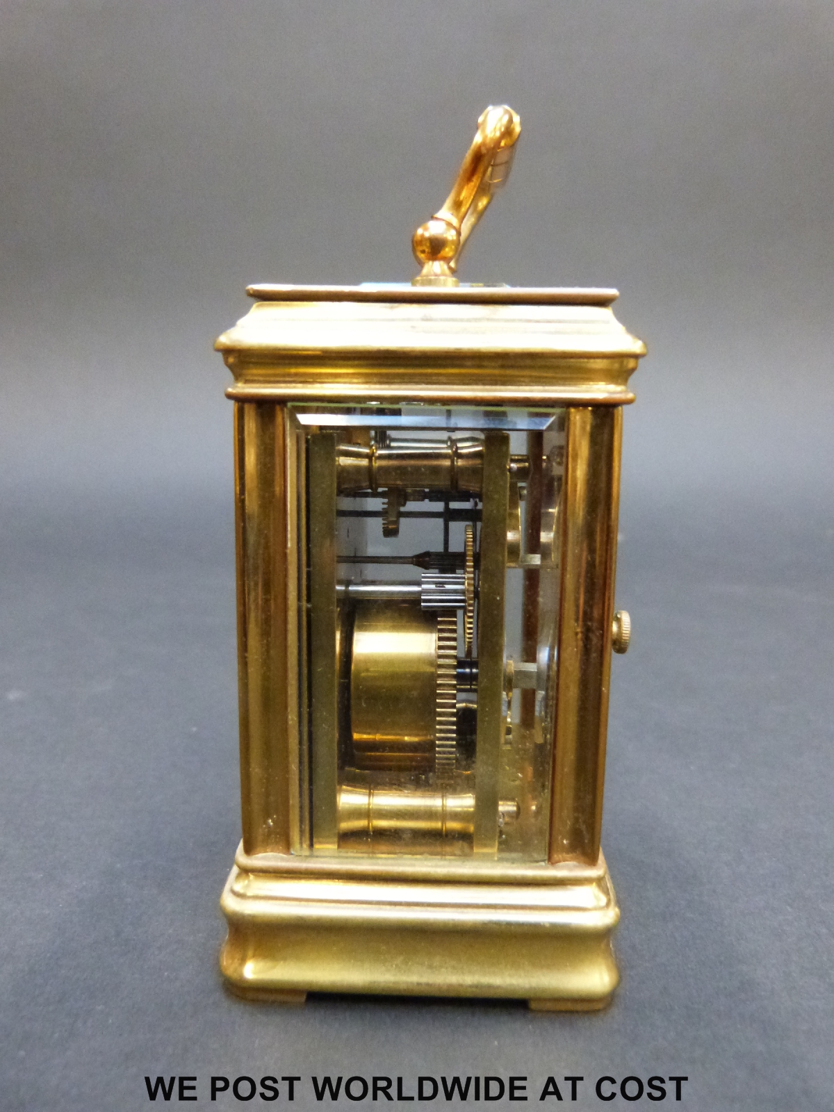 A brass cased miniature carriage clock in corniche style case with inset circular decorated - Image 7 of 9