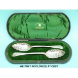 A cased pair of Victorian hallmarked silver berry spoons,