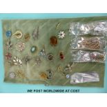 A collection of costume jewellery to include silver brooches,