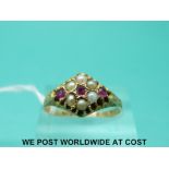 A 15ct gold Victorian ring set with seed pearls and rubies (size S)