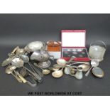 A quantity of silver plated cutlery, binoculars,