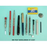 A quantity of pens, silver propelling pencils including an Art Deco enamel example,