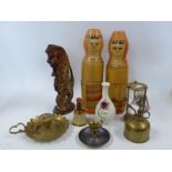 Two Russian doll vodka bottle holders, a miniature Bells, some decorative brassware,