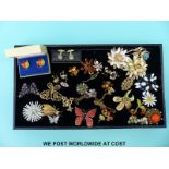 A quantity of brooches to include a Weiss crystal brooch in the form of a butterfly,