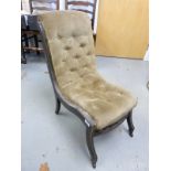 An upholstered Victorian ebonised nursing chair