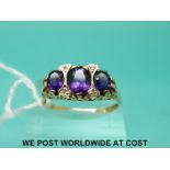A 9ct gold ring set with amethyst and diamonds (size U)