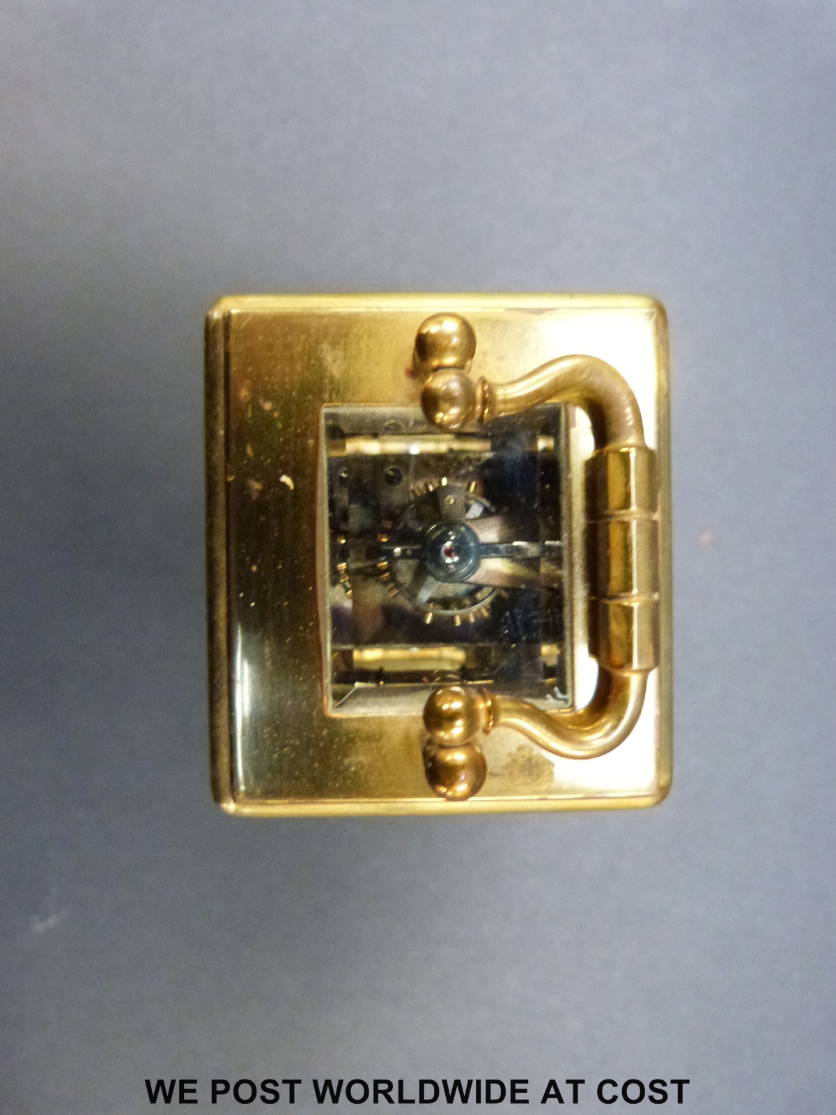 A brass cased miniature carriage clock in corniche style case with inset circular decorated - Image 9 of 9
