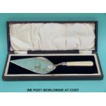 A cased hallmarked silver presentation trowel engarved "Presented to Mr W T Entwisle at the stone
