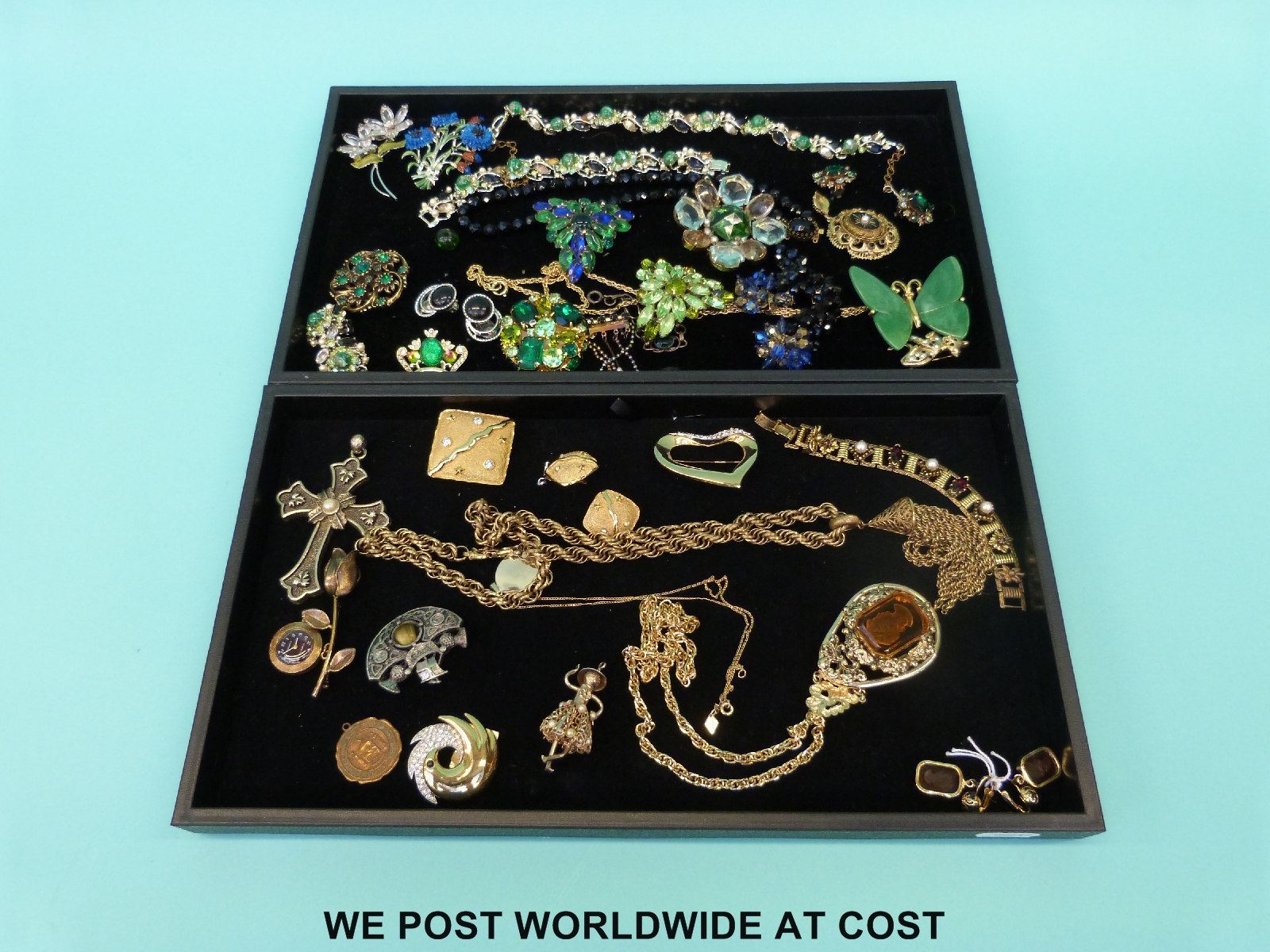 A quantity of costume jewellery to include a large cameo set necklace, Trifari brooch,