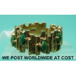 A 9ct gold ring set with turquoise in a textured setting (size G)