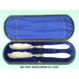 A cased pair of Victorian hallmarked silver and mother of pearl handled butter knives