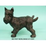 A cast iron doorstop formed as a dog lifting its leg (length 19cm)