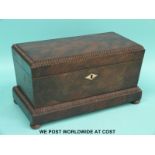 A 19thC mahogany sarcophagus shaped tea caddy with ivory inlay,