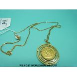 An 18ct gold pendant set with a 1963 full gold sovereign, on 18ct gold chain (17.