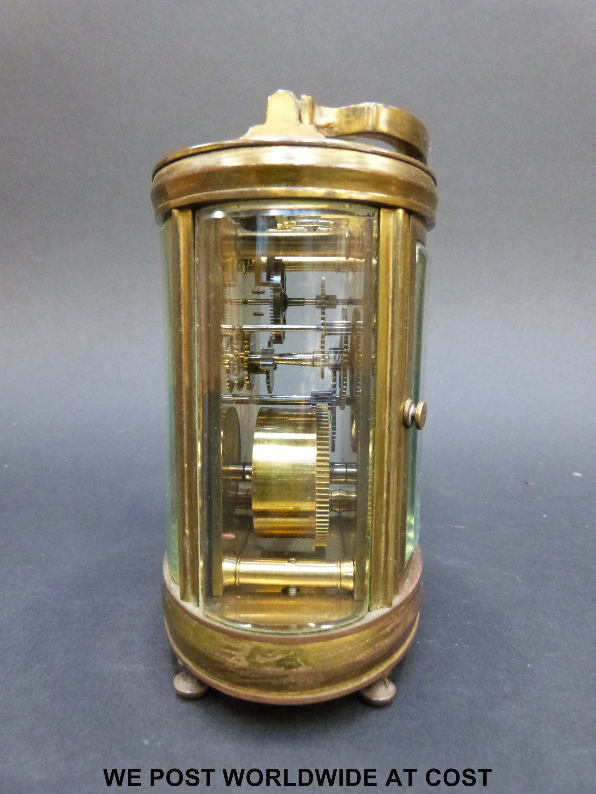 A mantel clock of oval section with bevelled glass and pierced gilt foliate panel to dial - Image 6 of 7