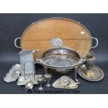 A large collection of silver plated items to include meat dome, serving dishes, candlesticks,