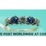 An 18ct gold ring set with three diamonds and two sapphires (size N)