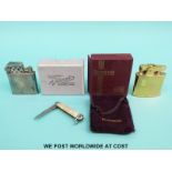 A boxed Ronson standard gold plated lighter,
