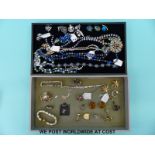 A quantity of costume jewellery to include necklaces, brooches,