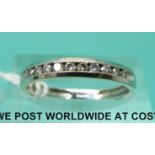 A 9ct white gold half eternity ring set with diamonds (size N)