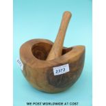 An olive wood pestle and mortar