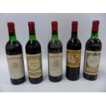 Five bottles of red wine comprising two bottles of Chateau Saint Pierre Sevaistre 1979,