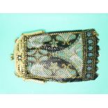 A micro metal mesh purse with gilt metal frame and enamel flower decoration