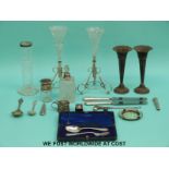 A pair of hallmarked silver trumpet vases (cased), a hallmarked silver spoon and fork set,